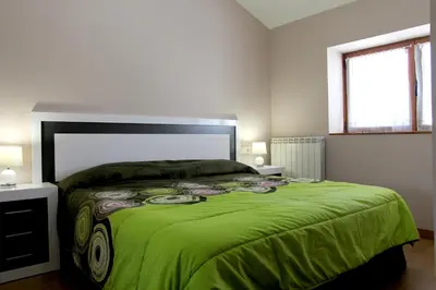 Cama o camas de una habitación en Casa Rural Primorena Txiki