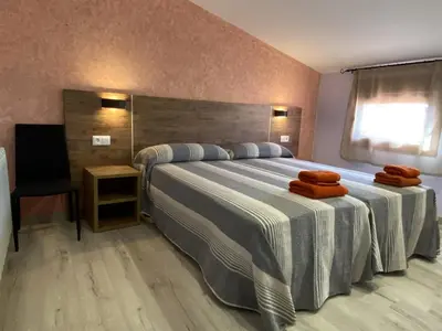 Cama o camas de una habitación en Apartamentos de turismo rural Las Eras