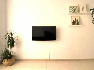 Una televisión o centro de entretenimiento en Apartamento Ayla San Fermín