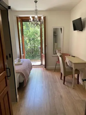 Cama o camas de una habitación en Leyendas Del Pirineo
