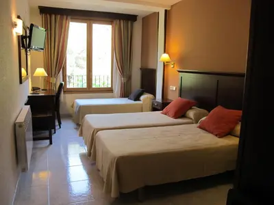 Cama o camas de una habitación en Hotel Turmo
