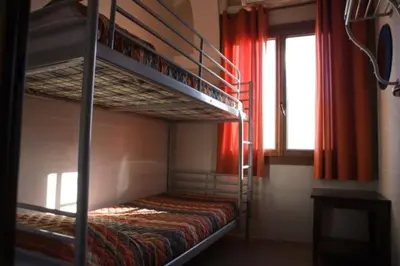 Cama o camas de una habitación en Be Zaragoza Hostel