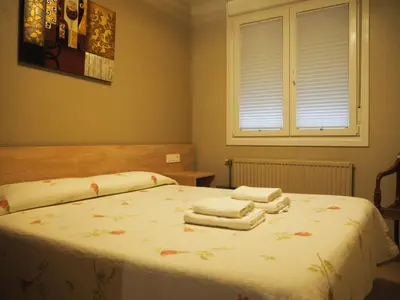 Cama o camas de una habitación en Hostal Acella