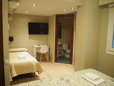 Una televisión o centro de entretenimiento en Hostal Acella