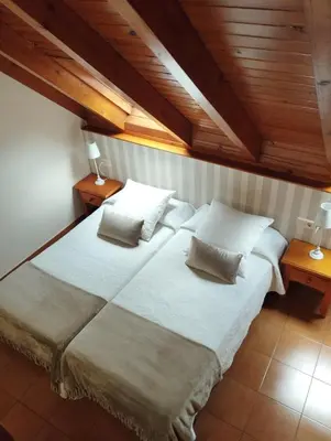 Cama o camas de una habitación en Hotel Ostau d'Òc