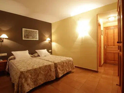 Cama o camas de una habitación en Hotel Ostau d'Òc