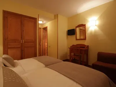 Cama o camas de una habitación en Hotel Ostau d'Òc