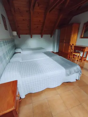 Cama o camas de una habitación en Hotel Ostau d'Òc