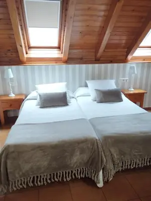 Cama o camas de una habitación en Hotel Ostau d'Òc