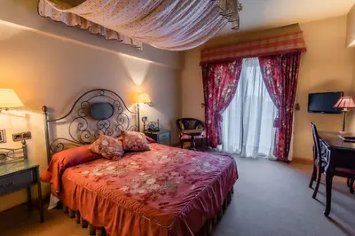 Cama o camas de una habitación en Hotel Alhama