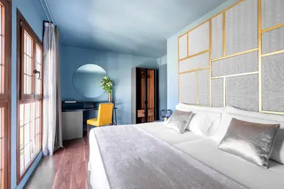 Cama o camas de una habitación en Pamplona Catedral Hotel