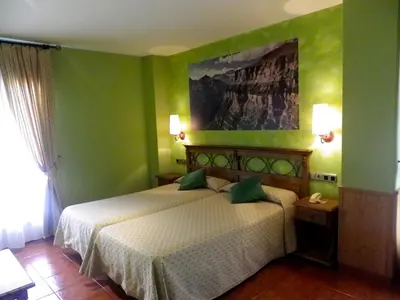 Cama o camas de una habitación en Hotel Arnal