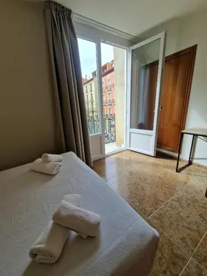 Cama o camas de una habitación en Hostal Rugaca