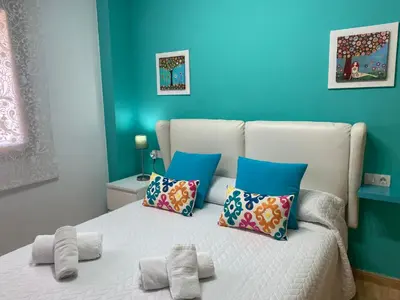 Cama o camas de una habitación en Apartamentos Alcañiz, Ana