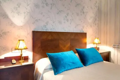 Cama o camas de una habitación en Hotel Villa San Jorge