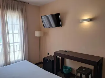 Una televisión o centro de entretenimiento en Hostal Rural Villa Vieja