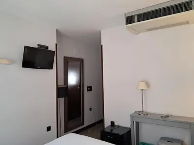 Una televisión o centro de entretenimiento en Hostal Rural Villa Vieja
