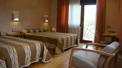 Cama o camas de una habitación en Hotel Los Nogales
