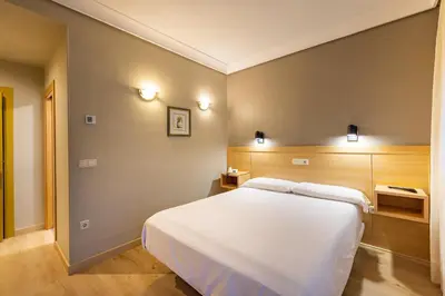 Cama o camas de una habitación en Hotel Santamaria