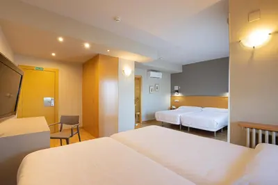 Cama o camas de una habitación en Hotel Santamaria