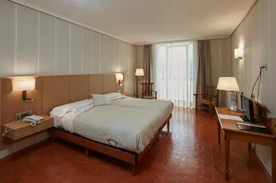 Cama o camas de una habitación en HOSTAL DOÑA JUANA