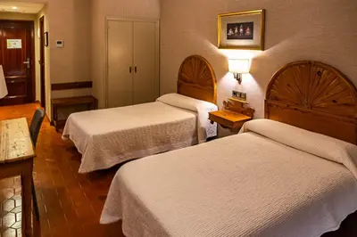 Cama o camas de una habitación en HOSTAL DOÑA JUANA