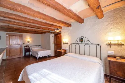 Cama o camas de una habitación en Casa Rural Moixella