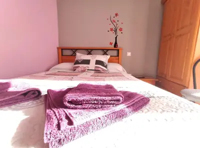 Cama o camas de una habitación en Hostal El Bodegon