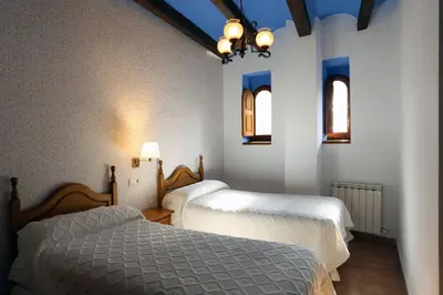 Cama o camas de una habitación en Hospedería Sádaba