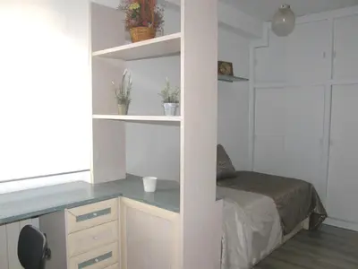 Cama o camas de una habitación en Ático con terraza en la Jota