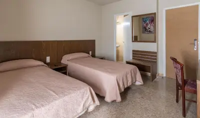 Cama o camas de una habitación en Hostal Sant Miquel