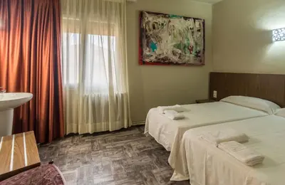 Cama o camas de una habitación en Hostal Sant Miquel