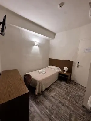 Cama o camas de una habitación en Hostal Sant Miquel