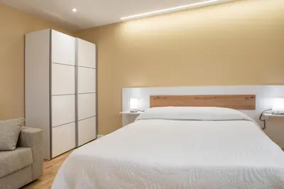 Cama o camas de una habitación en Apartamentos La Jasa