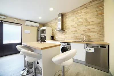 Una cocina o zona de cocina en Apartamentos La Jasa