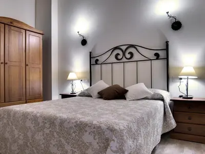 Cama o camas de una habitación en Apartamentos La Jasa