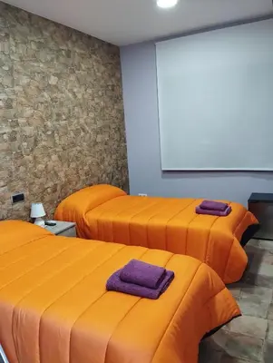 Cama o camas de una habitación en Pensión Matarraña