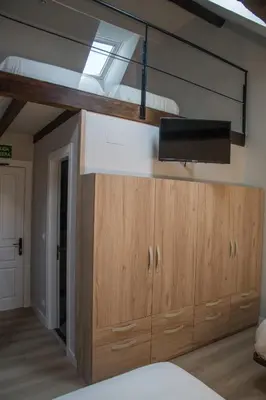 Cama o camas de una habitación en Posada de Roncesvalles