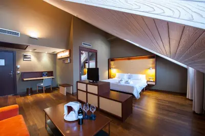 Cama o camas de una habitación en SOMMOS Hotel Aneto