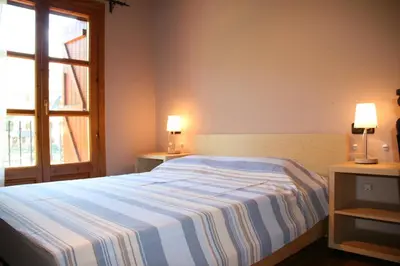 Cama o camas de una habitación en Apartamentos Cogulla