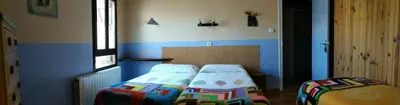 Cama o camas de una habitación en Albergue El Último Bucardo