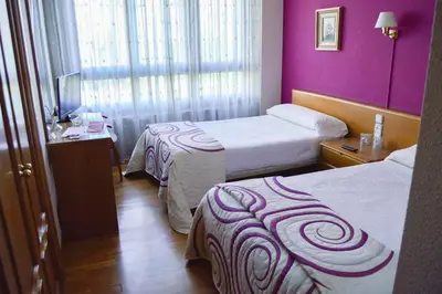 Cama o camas de una habitación en Pension Payvi