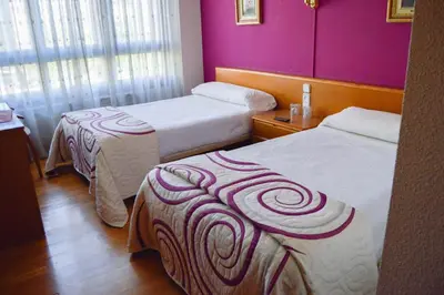 Cama o camas de una habitación en Pension Payvi
