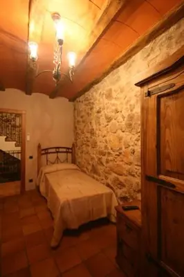 Cama o camas de una habitación en Casa Rural Cal Puyo