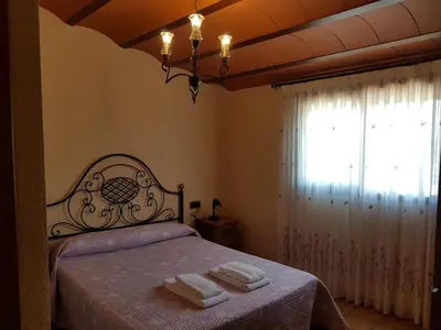Cama o camas de una habitación en Casa Rural Cal Puyo