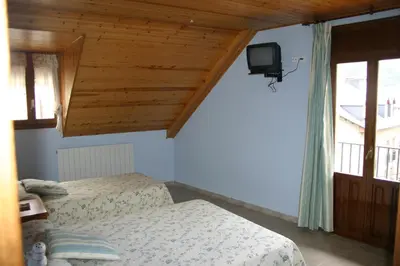 Una televisión o centro de entretenimiento en Casa Raspa