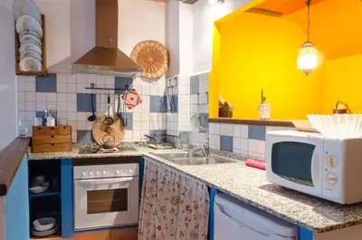 Una cocina o zona de cocina en La Llar-Lo Paller del Coc