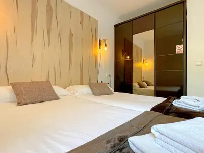 Cama o camas de una habitación en Apartamentos Puente La Reina