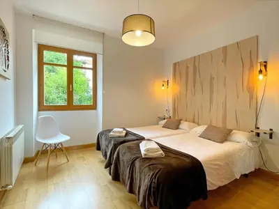 Cama o camas de una habitación en Apartamentos Puente La Reina