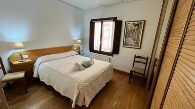 Cama o camas de una habitación en Pensión Buen Camino